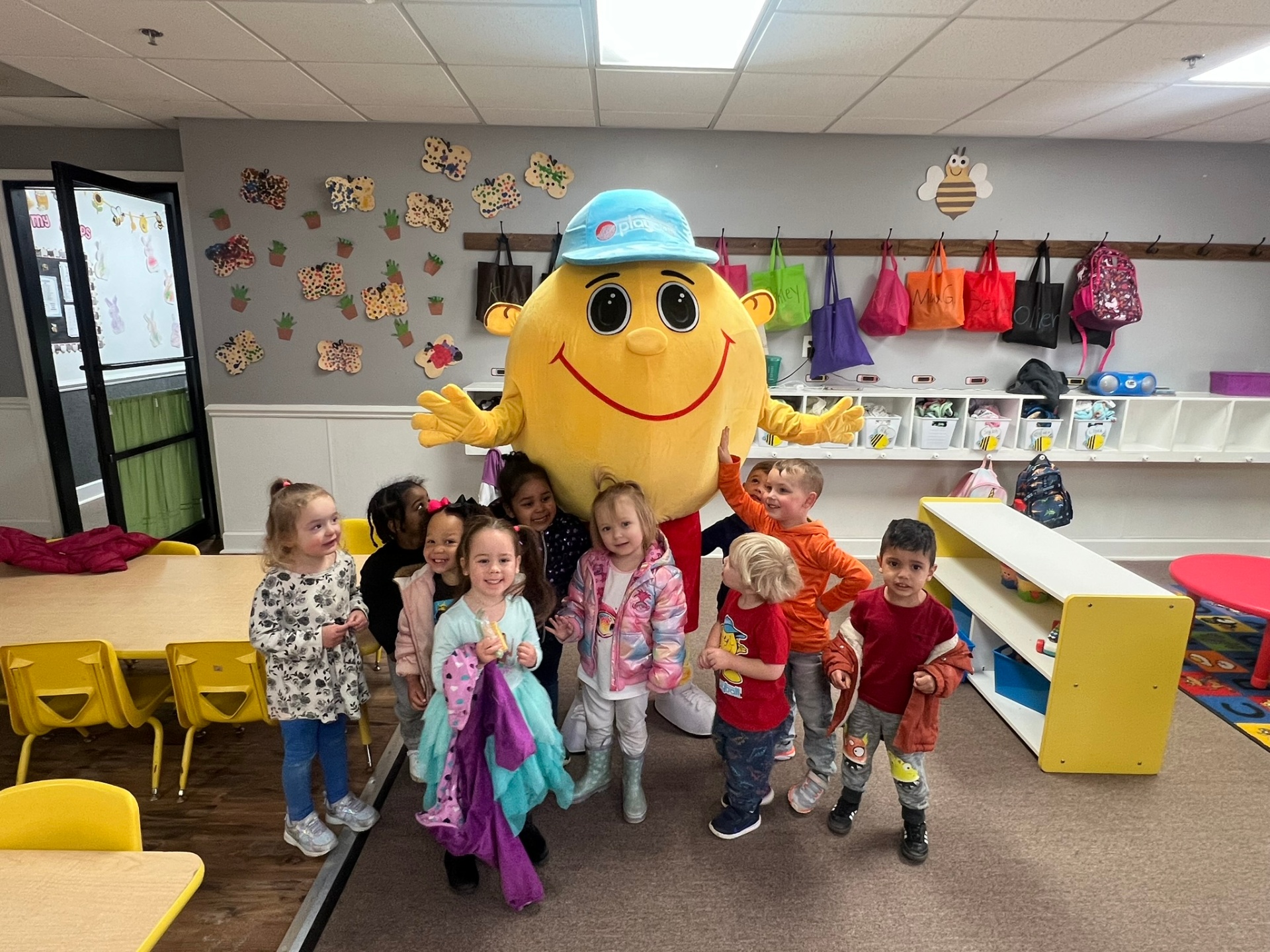 Mascot with a group of preschoolers in the classroom